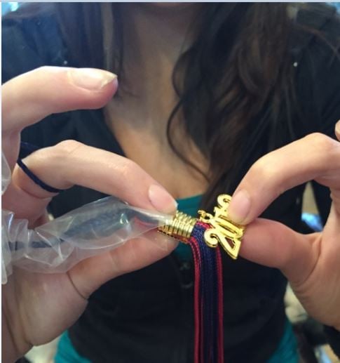 Attach the new year charm onto the tassel clasp