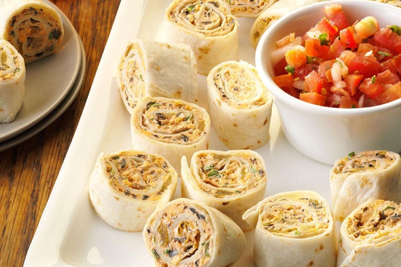 Fiesta pinwheel wraps sliced and served on a platter