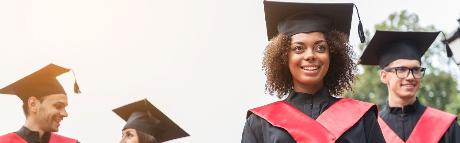 students graduating smiling