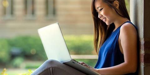 girl on computer outside