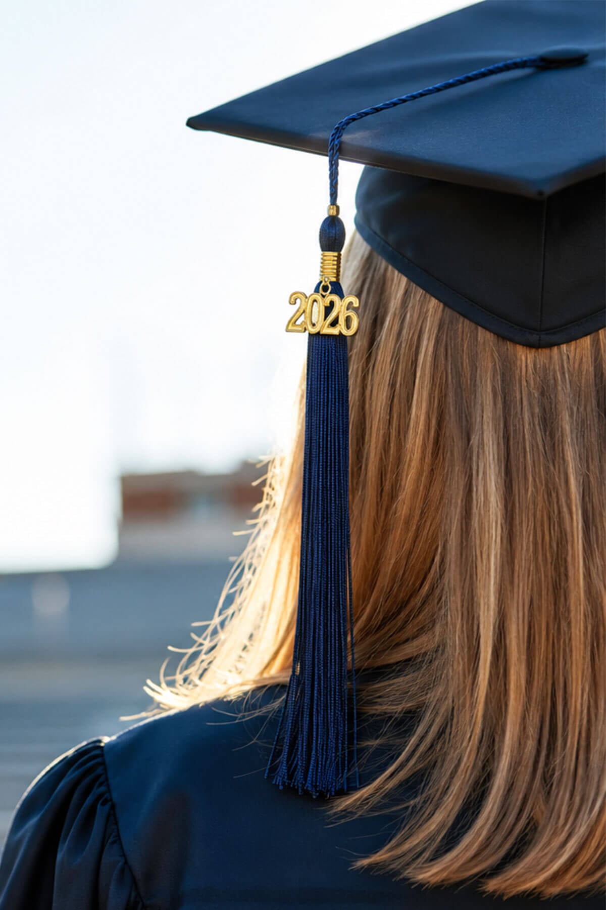 Graduation tassels and year charms for commencement caps