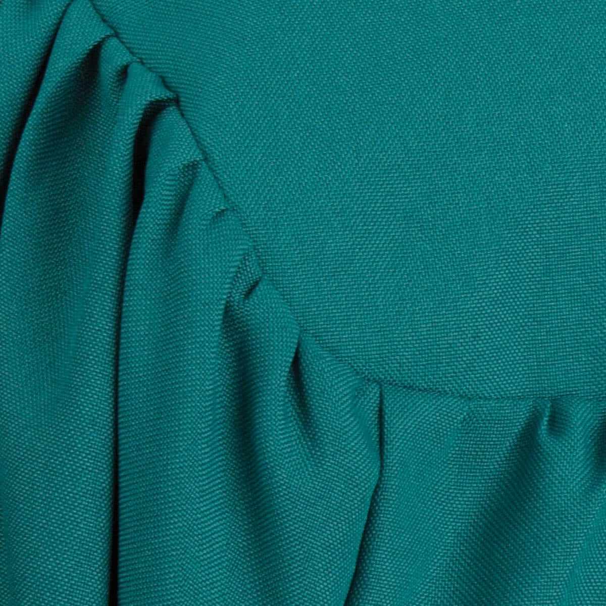 Close view of matte Emerald Green graduation gown fabric