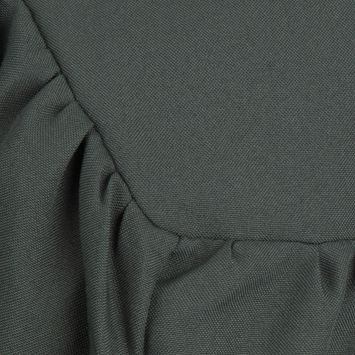 Close view of matte Forest Green graduation gown fabric