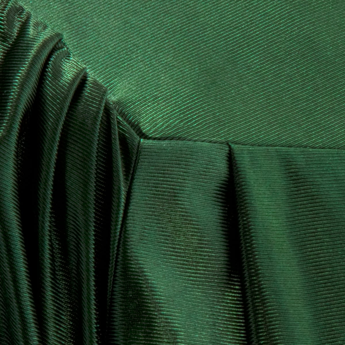 Close view of shiny Forest Green graduation gown fabric